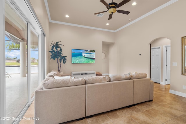 living room featuring crown molding and ceiling fan