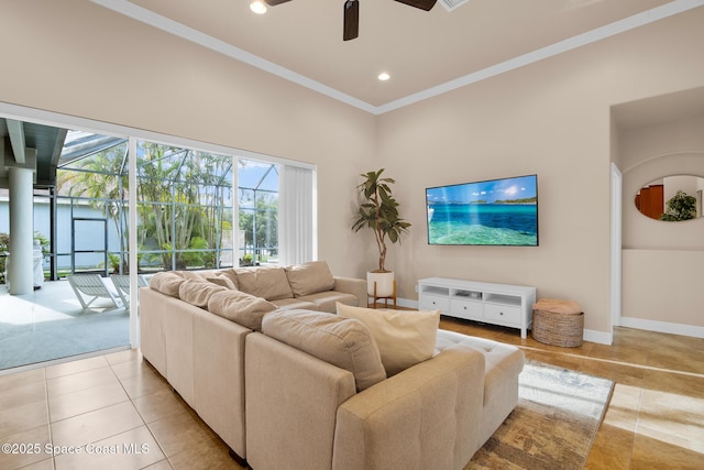 living room with light tile patterned flooring, ceiling fan, and crown molding