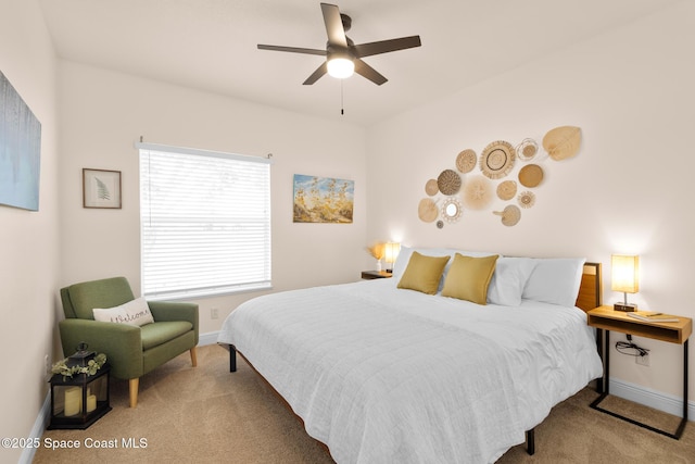 bedroom with light colored carpet and ceiling fan