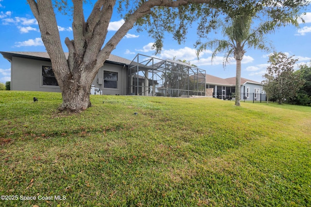 view of yard with a lanai