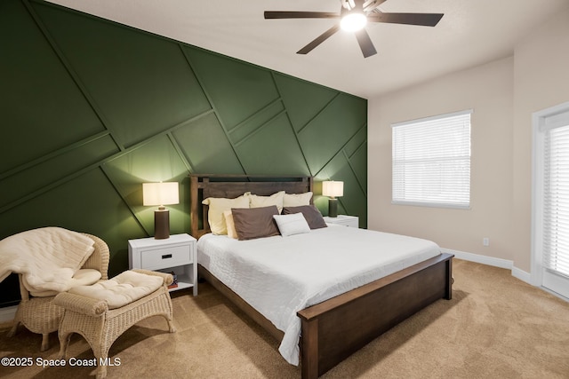 bedroom featuring ceiling fan and light colored carpet