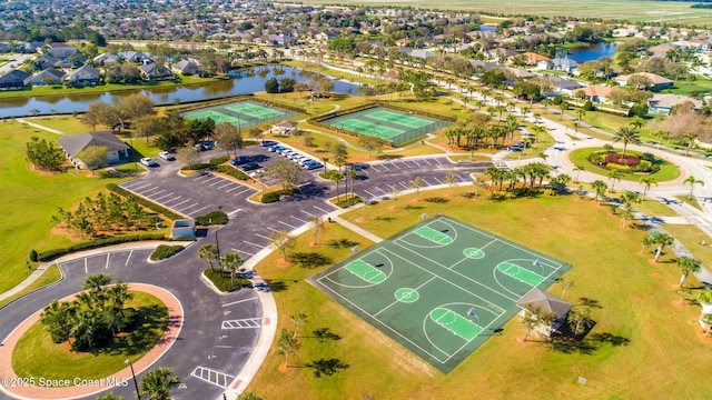 birds eye view of property with a water view