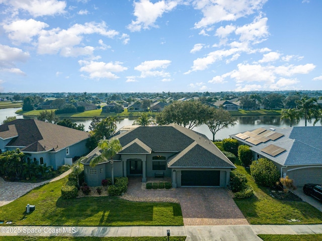 birds eye view of property featuring a water view