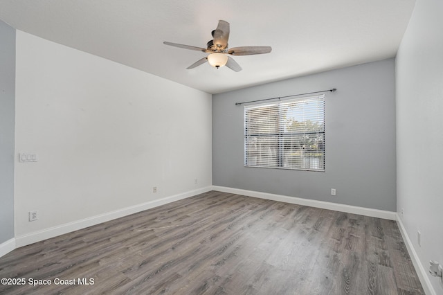 unfurnished room with ceiling fan and hardwood / wood-style floors