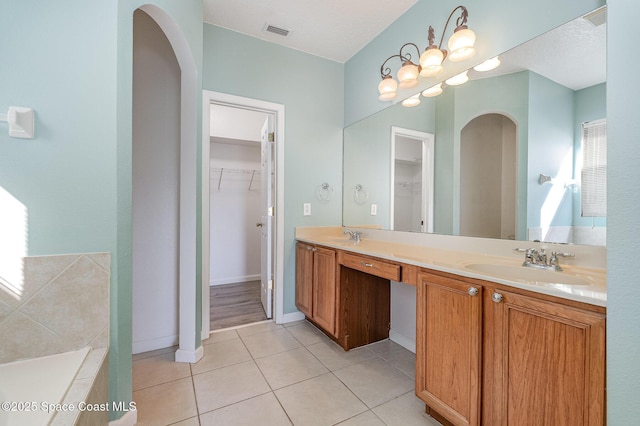 bathroom featuring tile patterned floors and vanity