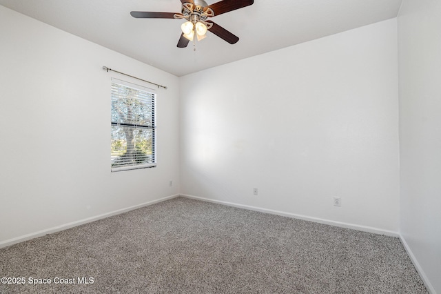 spare room featuring carpet floors and ceiling fan