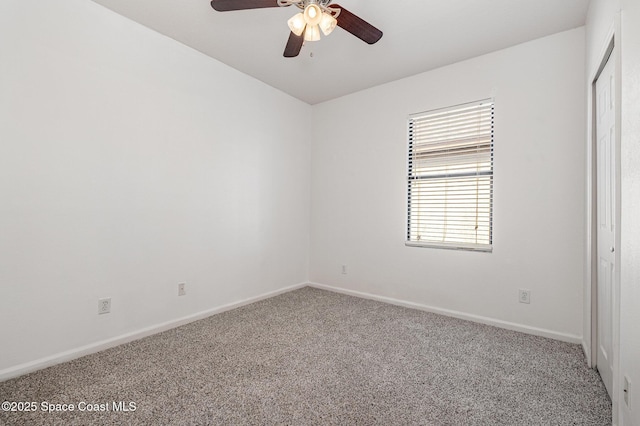 carpeted empty room with ceiling fan