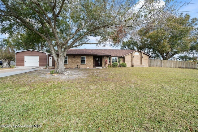 single story home with a garage, an outdoor structure, and a front yard