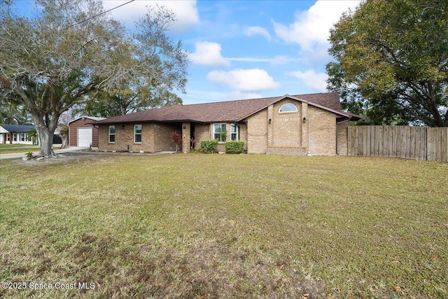 view of front of house featuring a garage and a front lawn