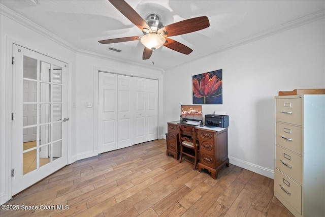 office space with crown molding, ceiling fan, and light wood-type flooring