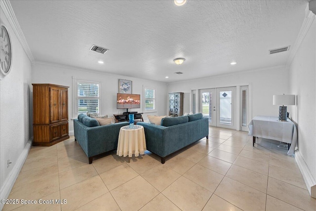 tiled living room featuring crown molding, french doors, and a textured ceiling