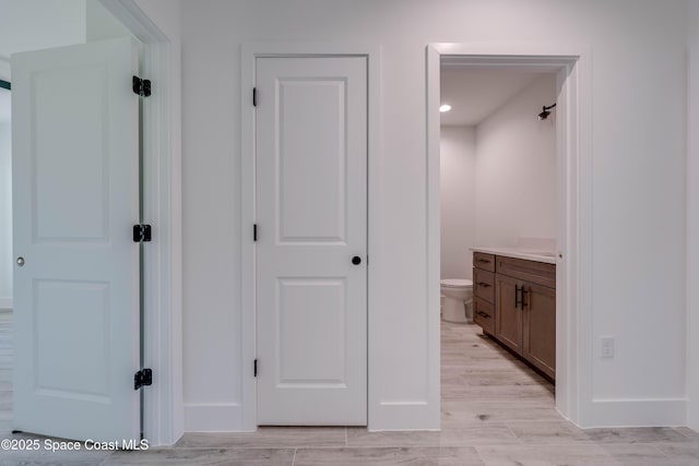 hall with light hardwood / wood-style flooring