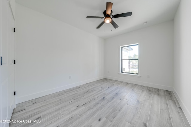 empty room featuring light wood-type flooring and ceiling fan