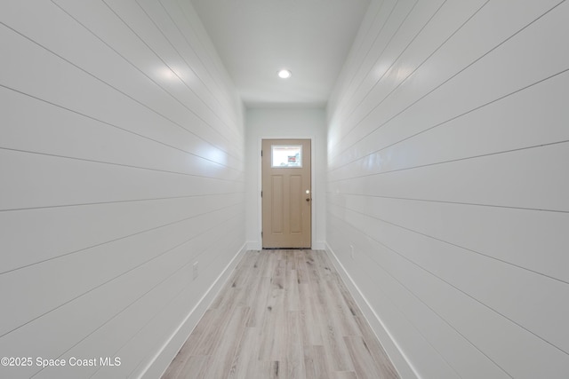 doorway to outside with light wood-type flooring