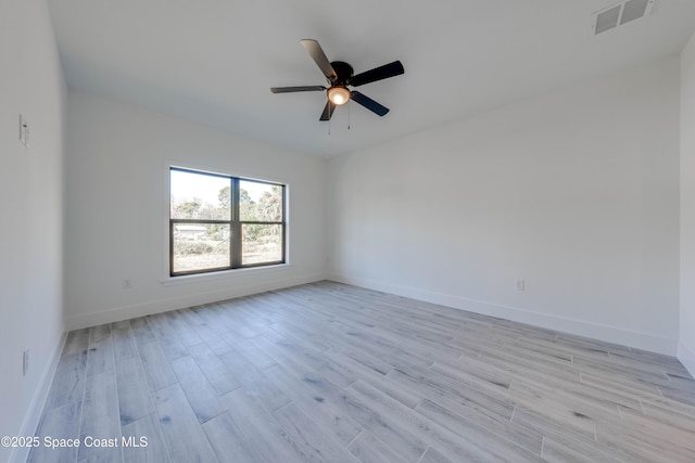 unfurnished room with ceiling fan and light hardwood / wood-style floors