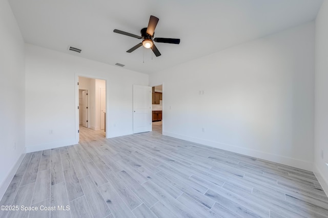 unfurnished bedroom with ceiling fan and light hardwood / wood-style flooring