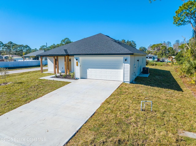 single story home featuring a front lawn and a garage