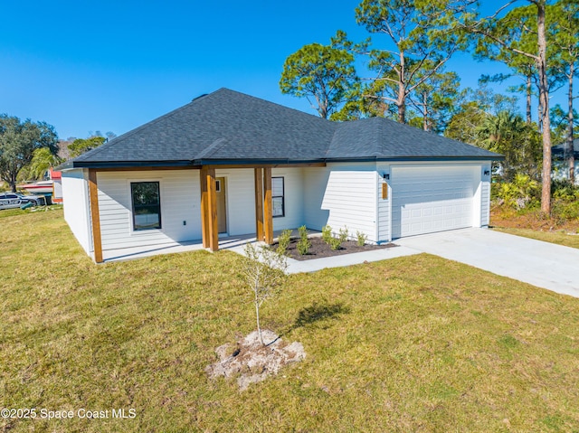 view of front facade with a front lawn and a garage