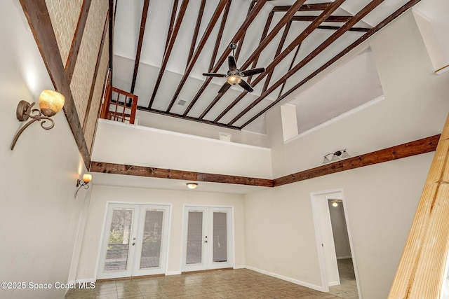 interior space with ceiling fan, high vaulted ceiling, and french doors