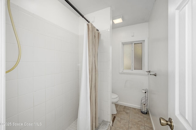 bathroom with curtained shower and toilet