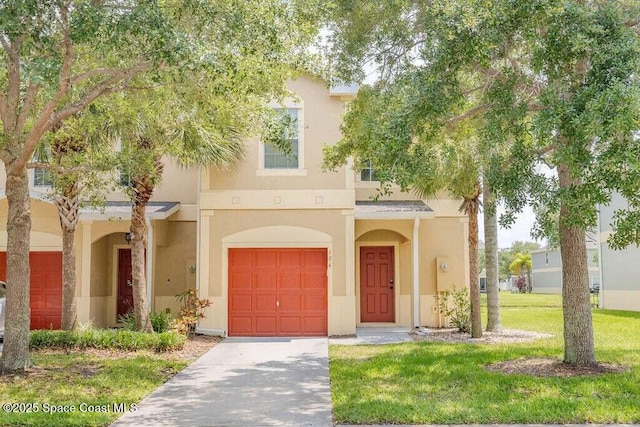 view of front of house featuring a front yard and a garage