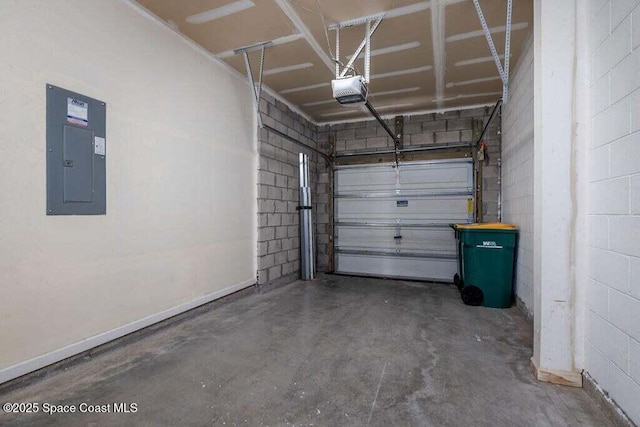 garage featuring electric panel and a garage door opener