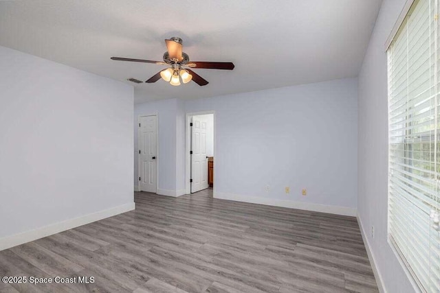 unfurnished room featuring ceiling fan and wood-type flooring