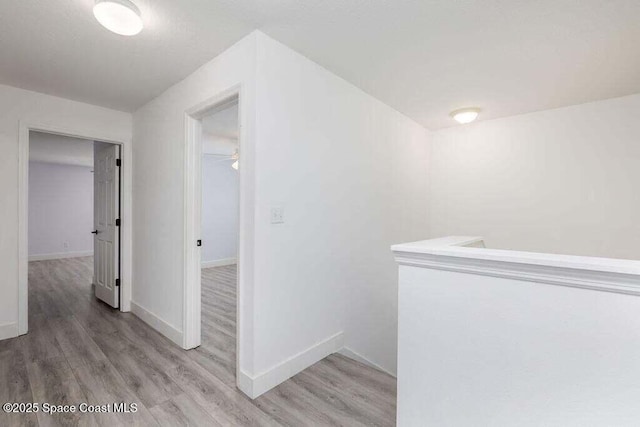 hallway with light wood-type flooring