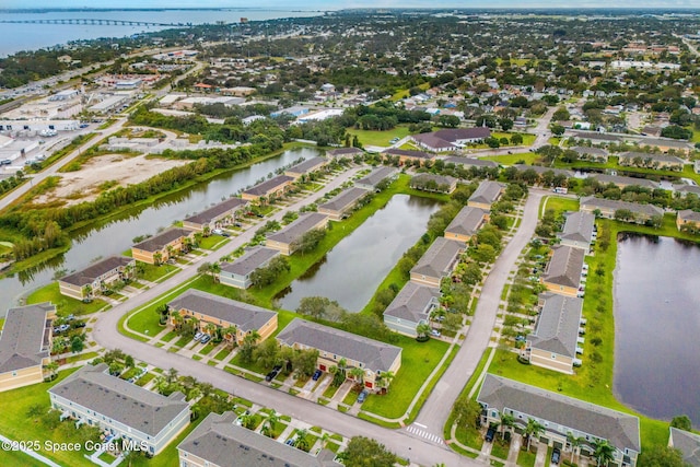 birds eye view of property featuring a water view