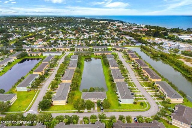 drone / aerial view with a water view