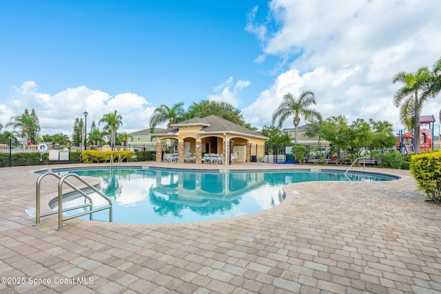 view of swimming pool with a patio area