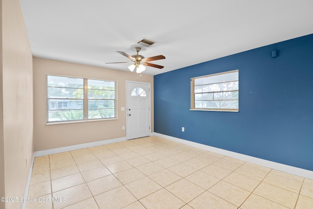 tiled entryway featuring ceiling fan