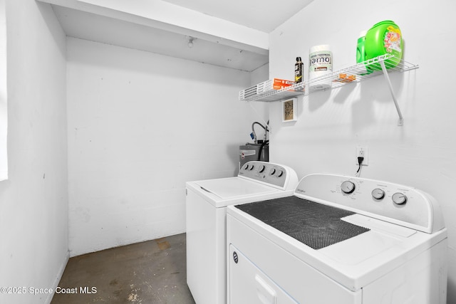 washroom featuring washing machine and dryer