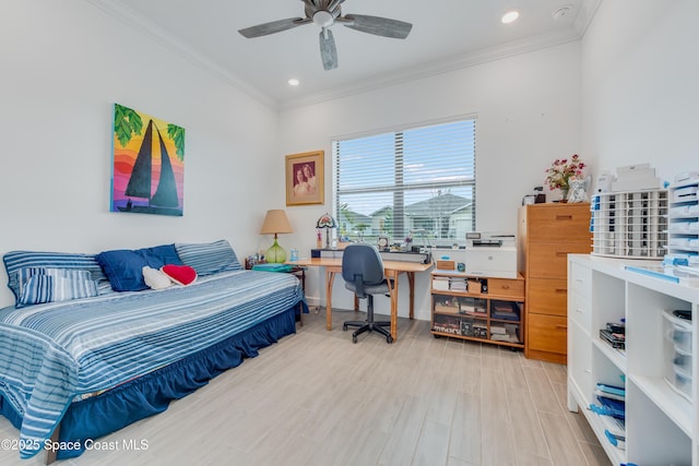 bedroom featuring ceiling fan, crown molding, and light hardwood / wood-style flooring