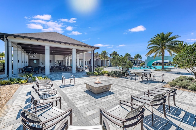 view of patio / terrace featuring an outdoor fire pit