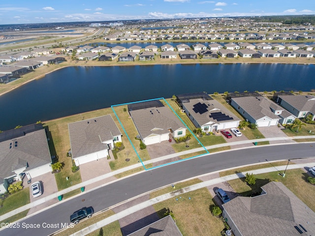 birds eye view of property featuring a water view