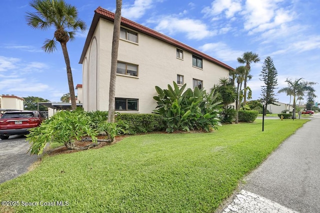 view of home's exterior featuring a lawn