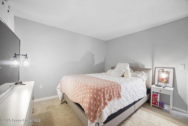 bedroom featuring light colored carpet