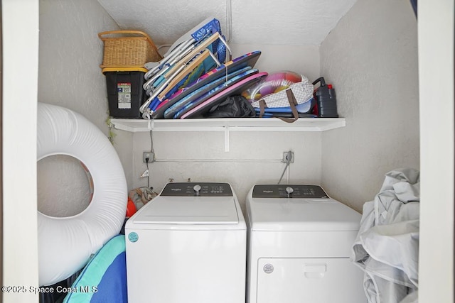 laundry room featuring washing machine and dryer