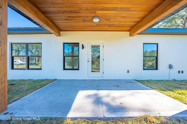 property entrance with a patio area