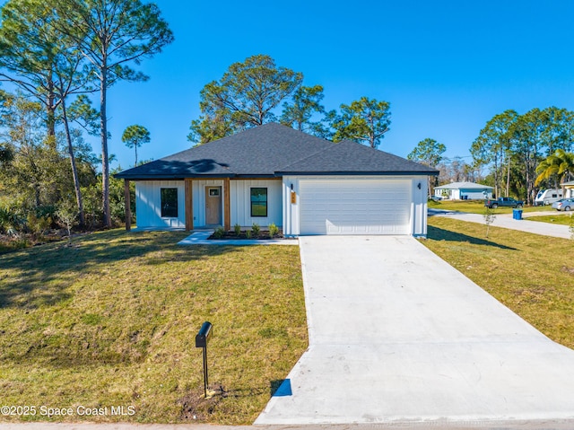 view of front facade with a front lawn and a garage