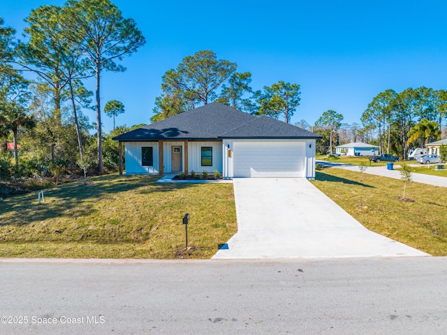 view of front of property featuring a garage and a front yard