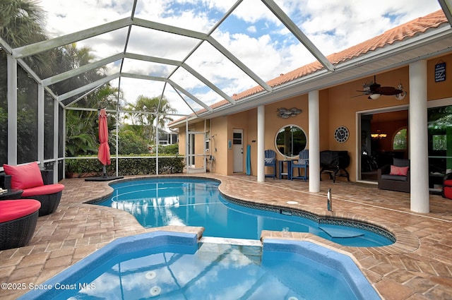 view of swimming pool featuring a lanai, an outdoor hangout area, a patio, and ceiling fan