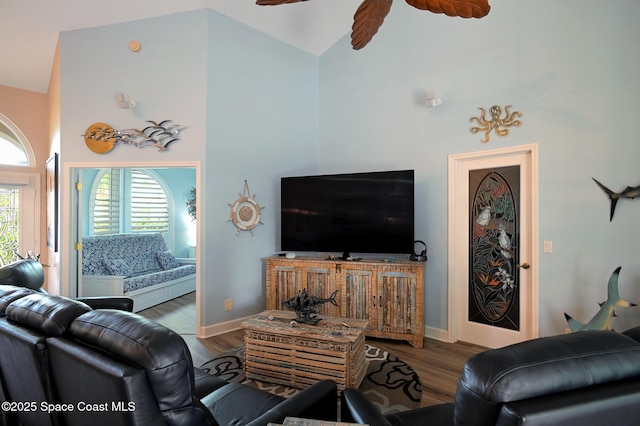 living room featuring ceiling fan, high vaulted ceiling, and hardwood / wood-style floors