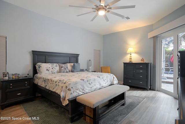 bedroom with ceiling fan, access to exterior, and light hardwood / wood-style floors