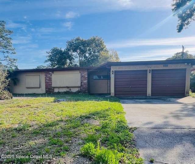 view of front of property with a garage and concrete driveway