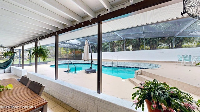 view of swimming pool with a lanai and a patio