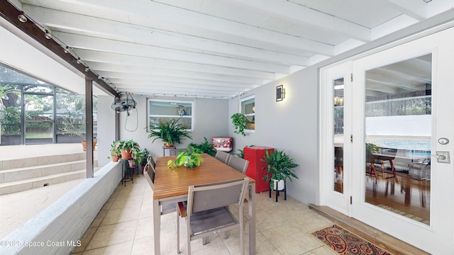 sunroom / solarium with beamed ceiling