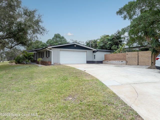 view of front of home with a garage and a front lawn