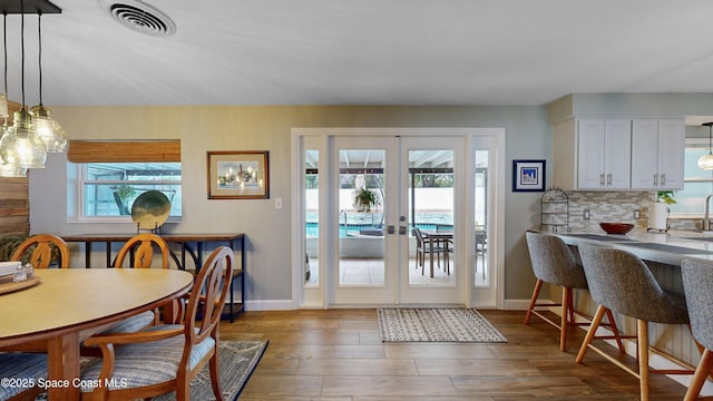 dining room featuring dark wood-type flooring and french doors